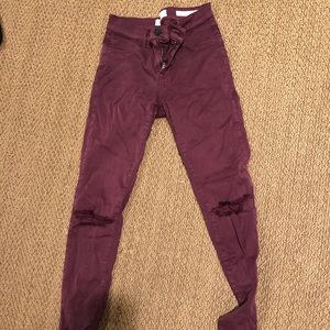 Maroon ripped jeans